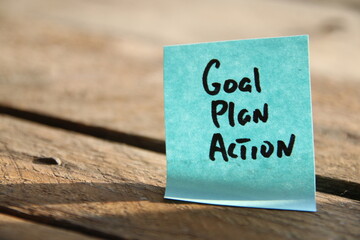 Goal Plan Action. Motivational quotes. The inscription on the blue tag.