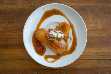 Top down view of Balinese Kolak Pisang (plantain or banana in coconut milk and sugar syrup) , horizontal