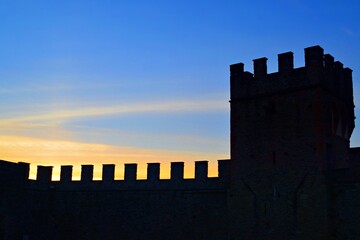 sunset sky and silhouette of the Castello dei Vicari in Scarperia in Mugello, Tuscany, Italy