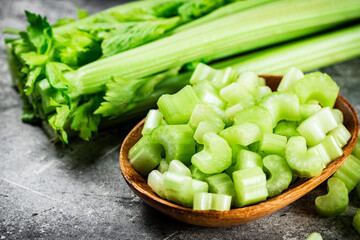 Cut into small pieces of celery in a plate. 