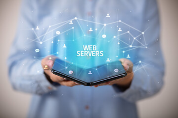 Businessman holding a foldable smartphone, new technology concept