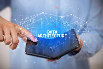 Businessman holding a foldable smartphone, new technology concept