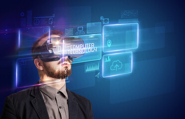 Businessman looking through Virtual Reality glasses, tech concept