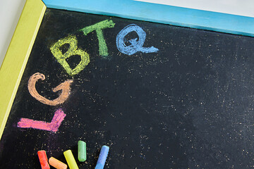 The concept of LGBT. A painted rainbow on a chalkboard. Copy space