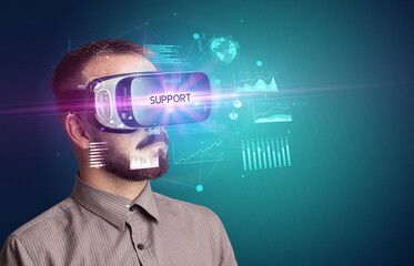 Businessman looking through Virtual Reality glasses