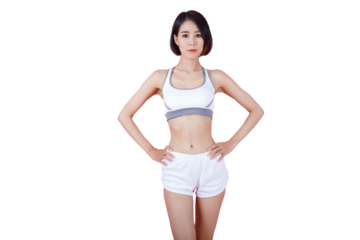 Confident sportswoman in white sportsbra, holding hands on waist, fitness trainer standing in power pose, workout in gym, pink background.