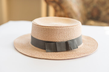 Flat lay of women's fashion accessories. Stylish female straw hat