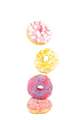 donuts colorful decorated doughnuts in motion falling without background isolated unhealthy food sweet dessert sugar flying no gravity bakery and pastry products with glaze and sprinkles sweet