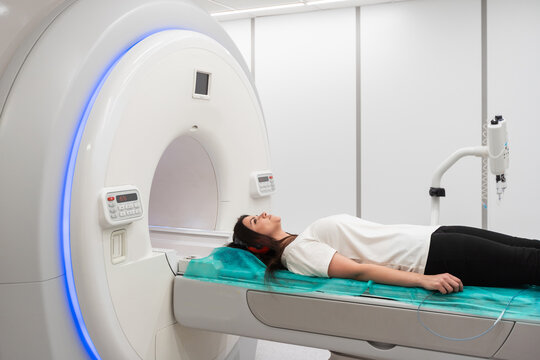 Medical CT or MRI Scan with a patient in the modern hospital laboratory. Interior of radiography department. Technologically advanced equipment in white room. Magnetic resonance diagnostics machine