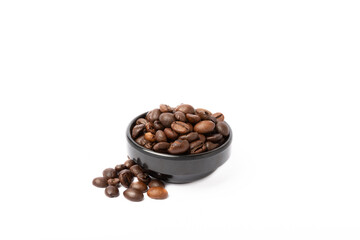Coffee beans in bowl isolated on white background.