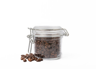 Coffee beans in glass jar isolated on white background.