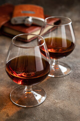 Cognac or whiskey in glasses on  dark background