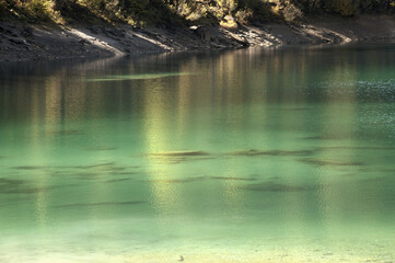 Teal waters of Lake Cauma, jewel of the Swiss Canton of Grisons