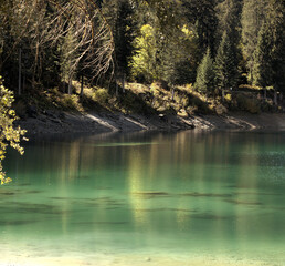 Teal waters of Lake Cauma, jewel of the Swiss Canton of Grisons