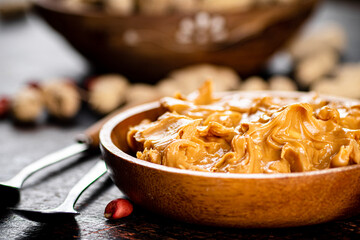 A plate of peanut butter on the table. 