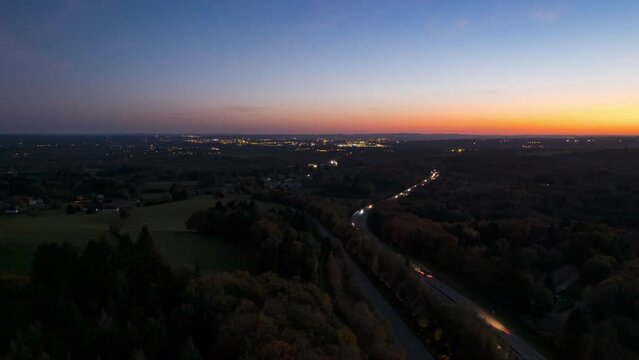 Drone Dusk Sunset Timelapse forward movement and discovery of the Limoges city light and cars on A20 speedway north of limoges city, France