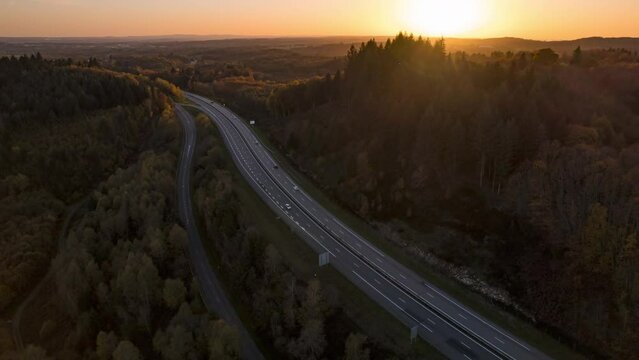 Drone Sunset Timelapse forward movement and discovery of the landscape above A20 speedway north of limoges city, France