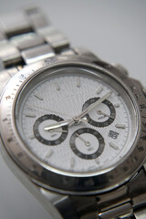 Elegant silver and white wrist watch with metal details