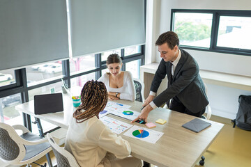 Diverse colleagues gather in brainstorm discuss statistics together. Group of people colleagues gather doing Brainstorming business plan together. Team Brainstorm Working Concept.