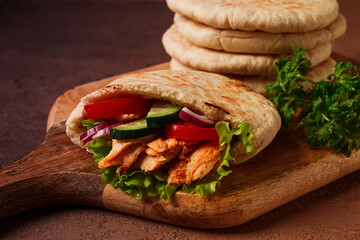Shawarma in pita bread, chicken, with vegetables, homemade, no people,