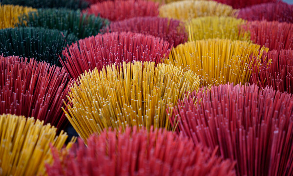 Colorful background of incense sticks being dried outdoor
