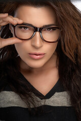 Fototapeta na wymiar Gorgeous Woman Face with Eyeglasses. Cool Trendy Eyewear Portrait