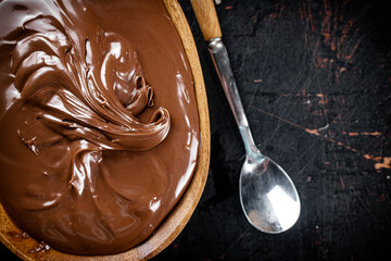 Hazelnut butter in a plate with a spoon. 