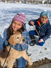 Children with their new puppy. 
