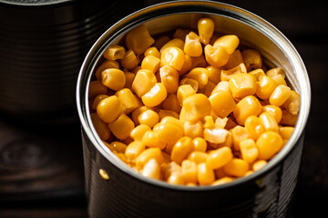 An open can of canned corn. 