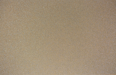 Brown background from decorative plaster with abstract spots. Unusual beige wall texture with beautiful patterns, creative surface background. Front covering for facing of buildings.