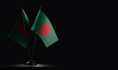 Small national flags of the Bangladesh on a black background