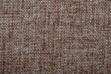 Close-up fabric swatches as a background. The texture of the material with patterns of weaving close-up. Upholstery fabric for interior decoration.