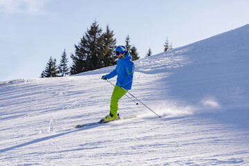 Fototapeta na wymiar man and woman skiing and snowboarding in the mountains, ski reso