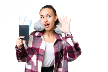 Young Traveler woman holding a passport over isolated chroma key background listening to something by putting hand on the ear