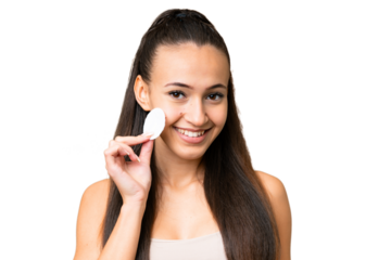 Young Arabian woman over isolated chroma key background with cotton pad for removing makeup from her face