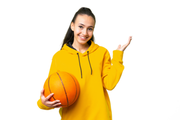 Young Arabian woman playing basketball over isolated wall  over isolated chroma key background extending hands to the side for inviting to come