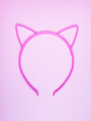 Pink plastic hoop with cute ears for hair.