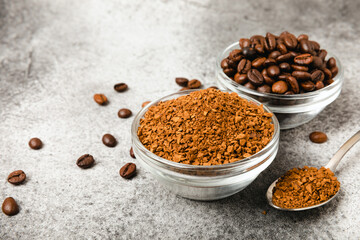 Instant coffee and coffee beans on a black stone background. Aromatic coffee drink. Place for text. Space for copy text
