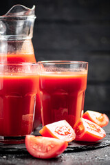 Tomato juice on a stone board. 