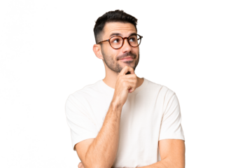 Young handsome caucasian man over isolated chroma key background thinking an idea while looking up