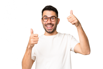 Young handsome caucasian man over isolated chroma key background giving a thumbs up gesture