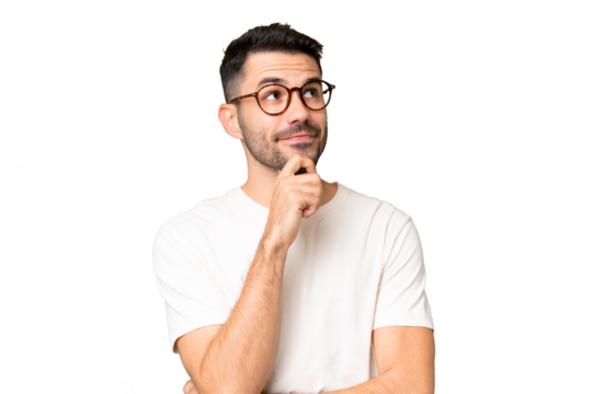 Young handsome caucasian man over isolated chroma key background thinking an idea while looking up