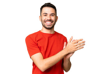 Young handsome caucasian man over isolated chroma key background applauding
