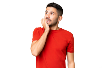 Young handsome caucasian man over isolated chroma key background is a little bit nervous