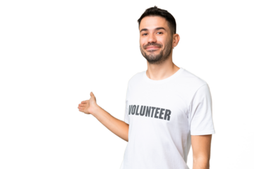 Young volunteer caucasian man over isolated chroma key background extending hands to the side for inviting to come