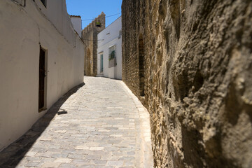 Fototapeta na wymiar City stone walls in the old town of the white beautiful village of Vejer de la Frontera in a sunny day, Cadiz province, Andalusia, Spain