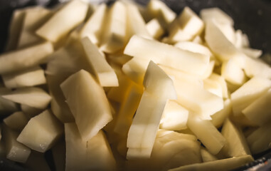 Pile of raw chopped potatoes