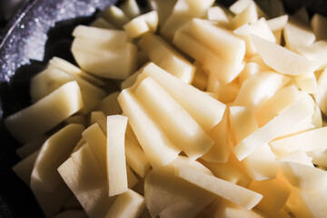 Pile of raw chopped potatoes