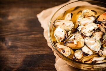 Pickled mussels in a glass bowl. 
