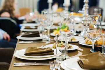 a festive served table with snacks and tableware.